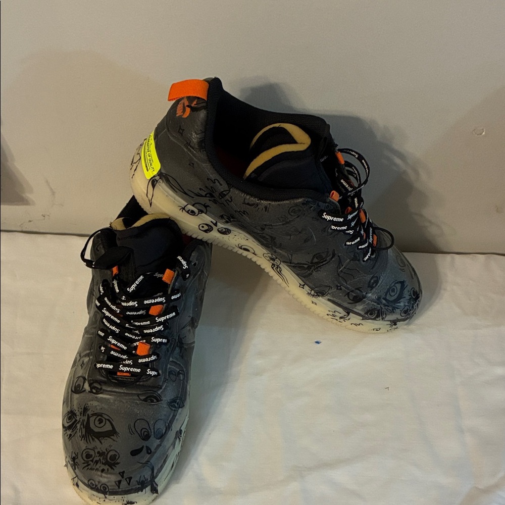 Supreme Black and Orange Graphic Sneakers